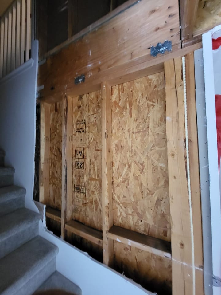 Contained and dried framing in the stairway at close-out, ready for rebuild, Chino Hills, CA.