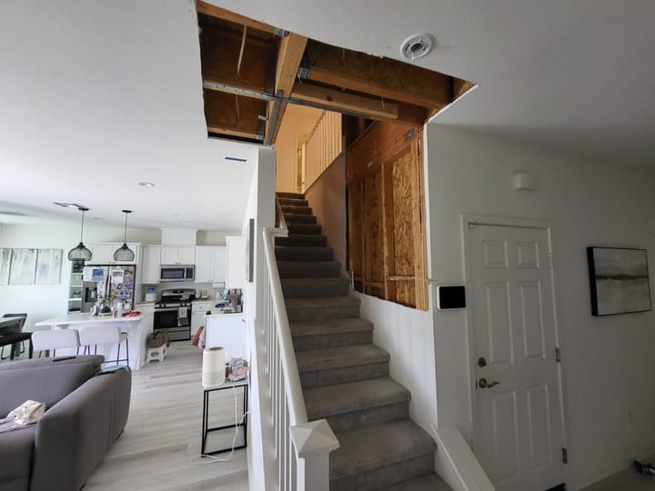 Contained and dried framing in the stairway at close-out, ready for rebuild, Chino Hills, CA.