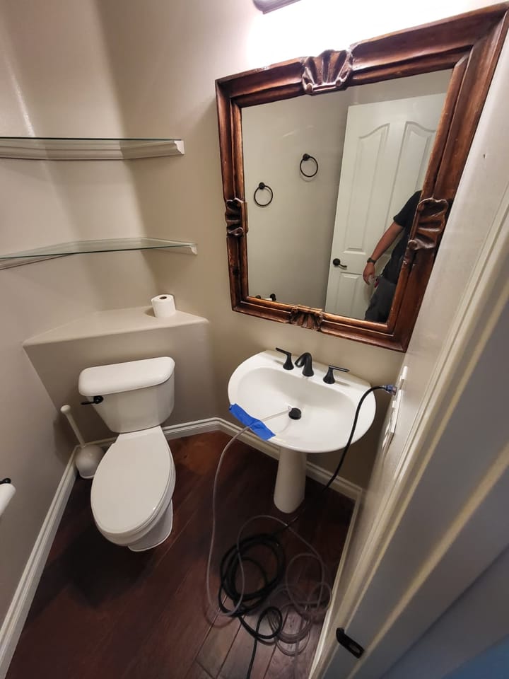 EMS crew documenting moisture damage in the bathroom, Rancho Cucamonga, CA.