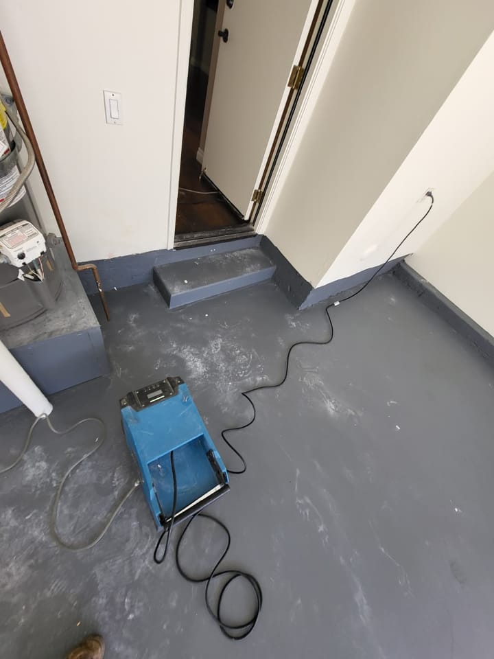 EMS crew documenting moisture damage in the garage, Rancho Cucamonga, CA.