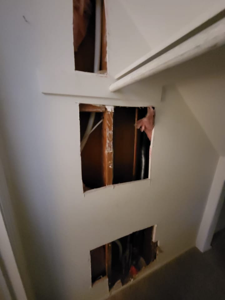 EMS crew documenting moisture damage in the hall closet, Rancho Cucamonga, CA.