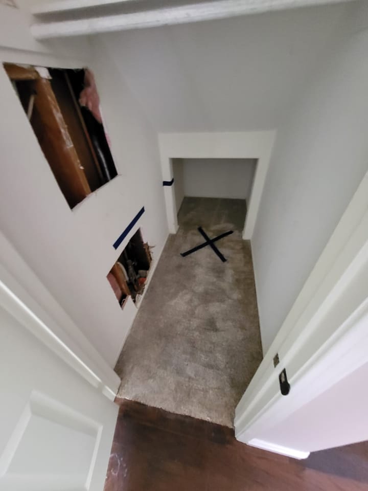 EMS crew documenting moisture damage in the hall closet, Rancho Cucamonga, CA.