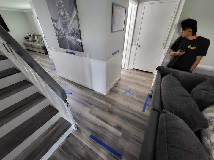 EMS crew documenting moisture damage in the hallway, Riverside, CA.