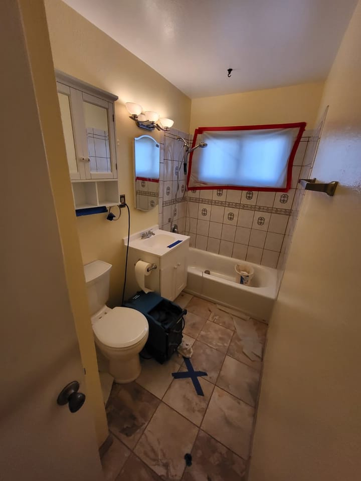 Flood cut demolition in the hall bathroom, San Bernardino, CA.