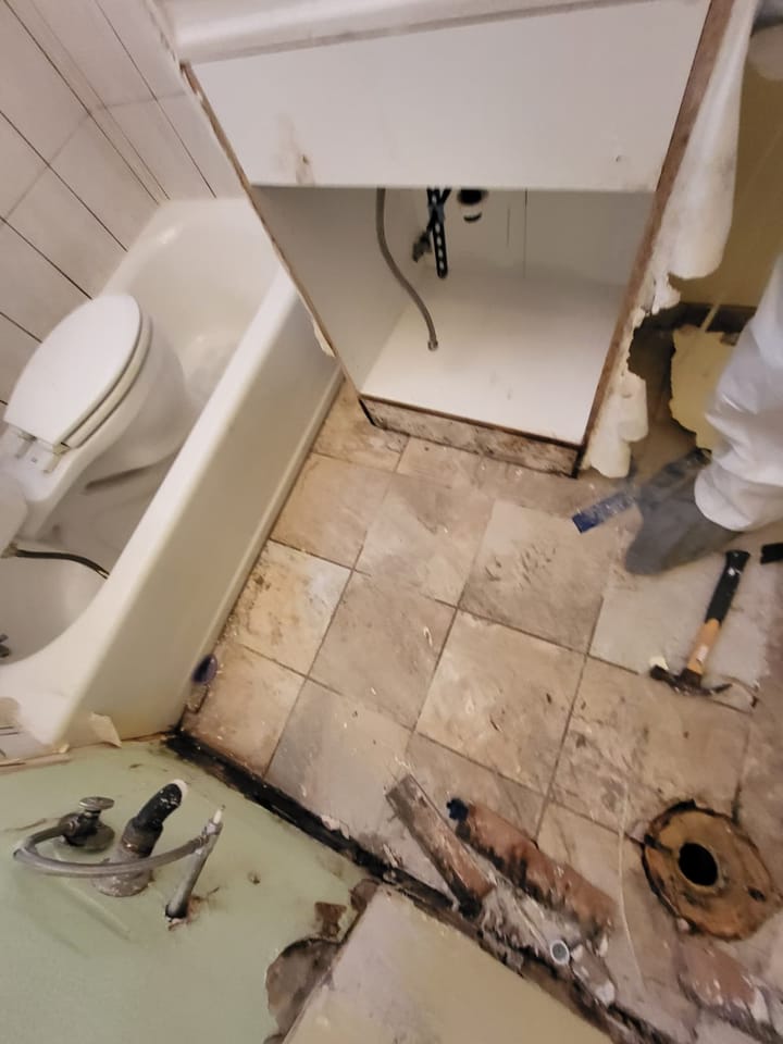 Flood cut demolition in the hallway bathroom, San Bernardino, CA.