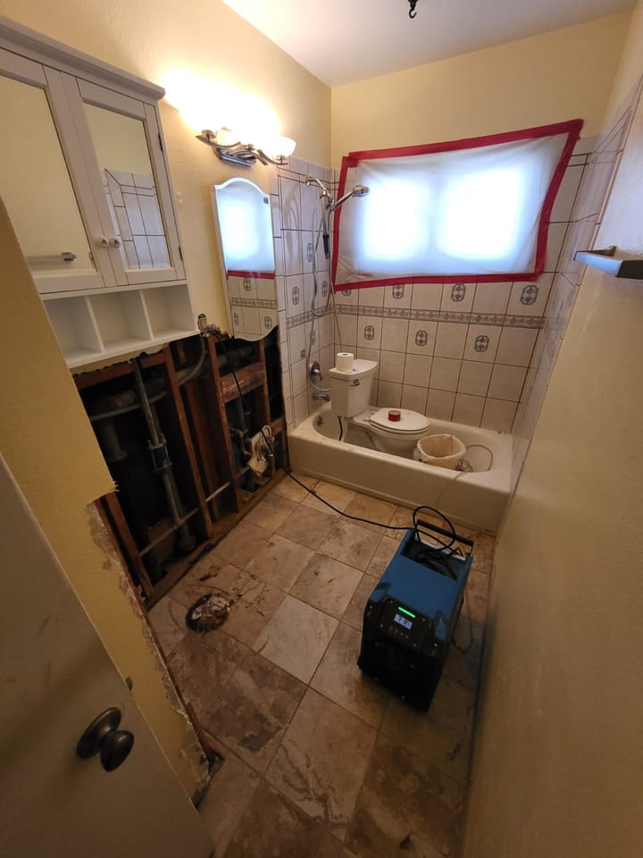 Mold remediation and drying equipment in the hall bath, San Bernardino, CA.